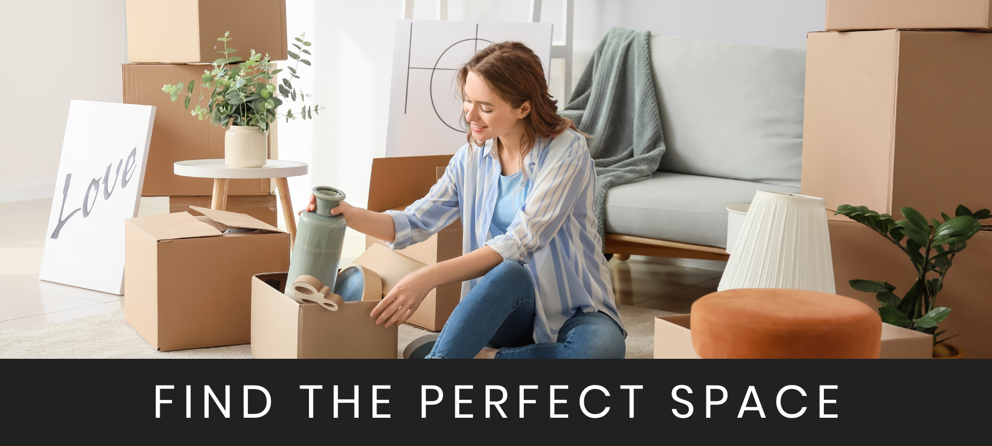 woman unpacking boxes inside new apartment